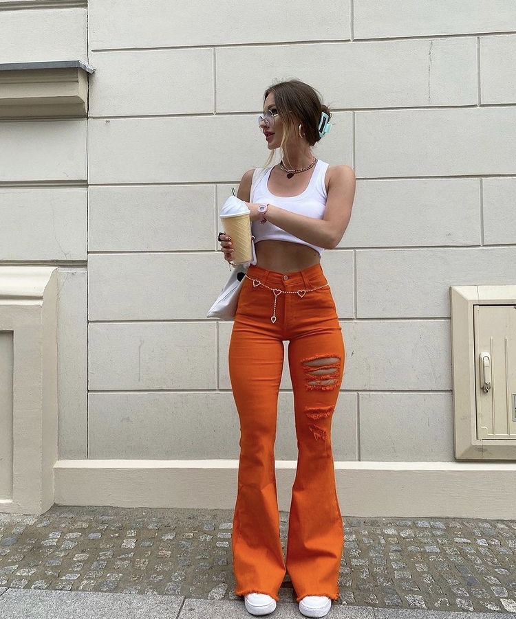 orange flared jeans  pants outfit